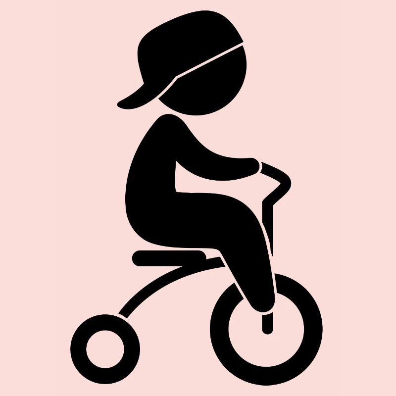 Junge, der sein Dreiräder reitet