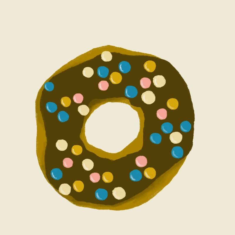 Donut with chocolate icing and colorful chocolate lentils