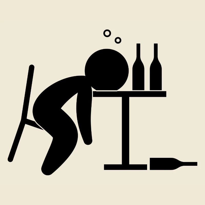 An alcoholic is drunk on the table