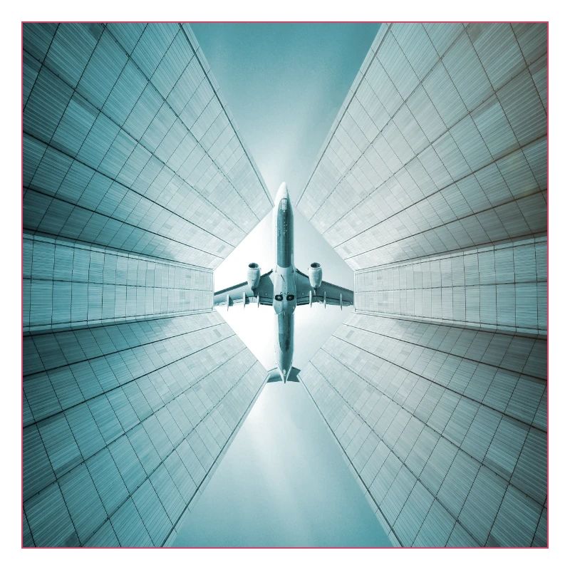 Plane over skyscrapers