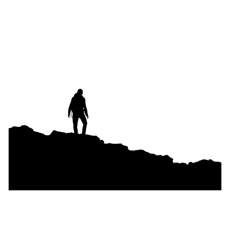 Silhouette eines Wanderers auf dem Gipfel des Berges