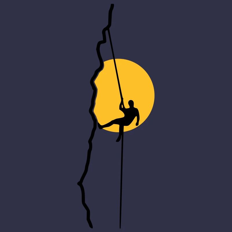 Climber rappelling in the sunset
