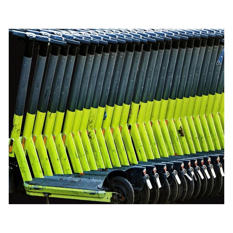 neon green e-scooters parked in row