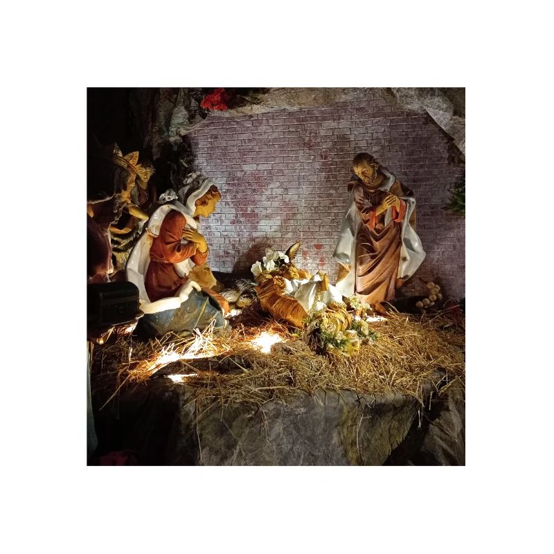 Illuminated Nativity Scene between Stones