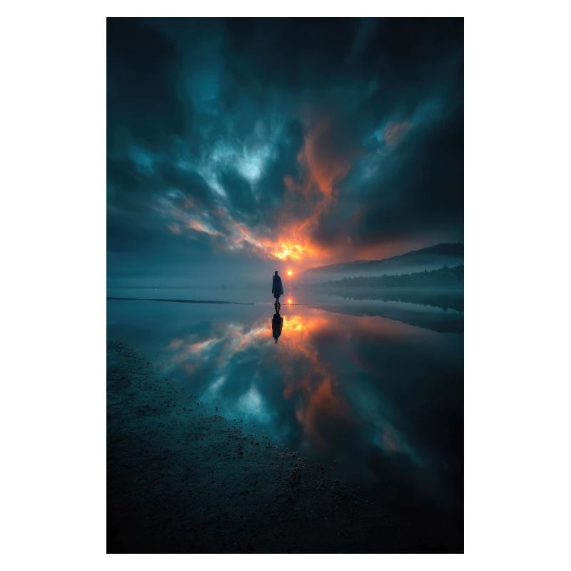 Solitary Sunset Reflections on a Misty Shore