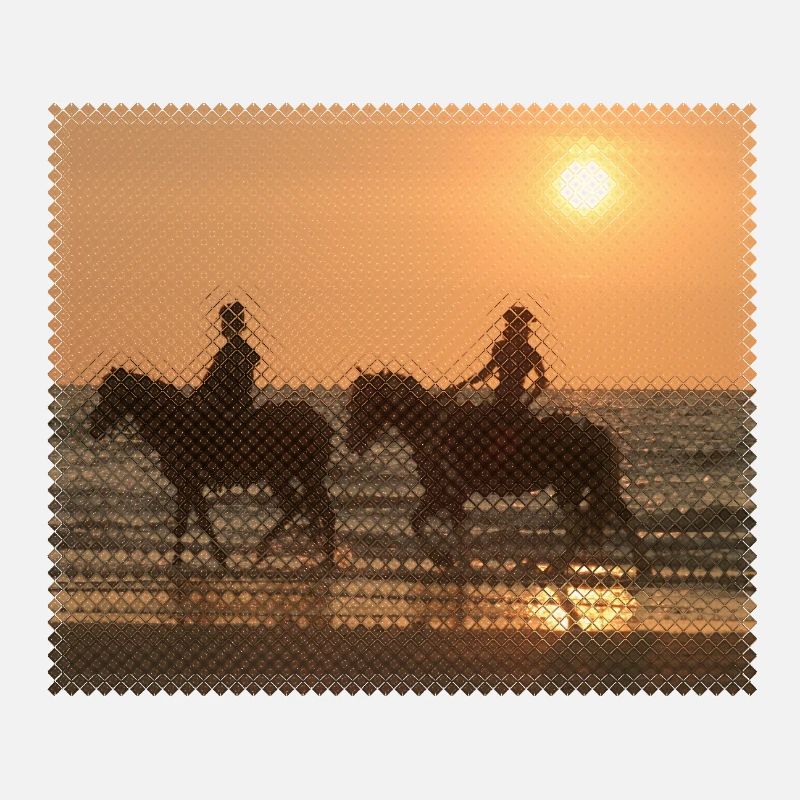 Cavalier au coucher du soleil sur la plage
