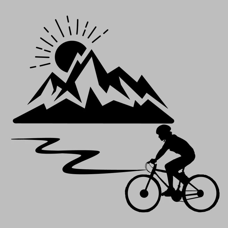 Radfahrer mit Bergen im Hintergrund und Sonne verschwindet