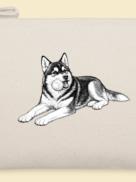 Verspielter Husky mit Kugel