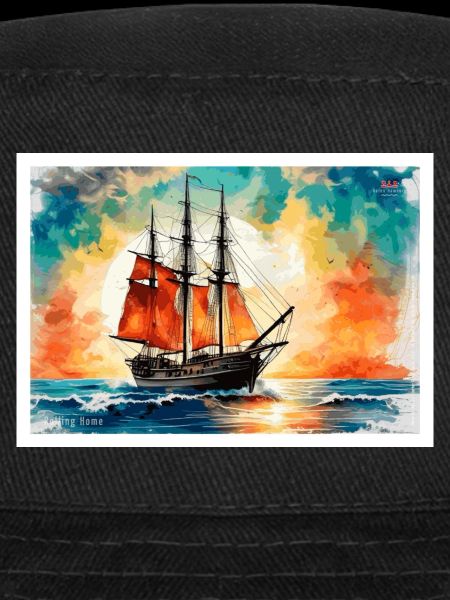 Red sailing ship at sunset