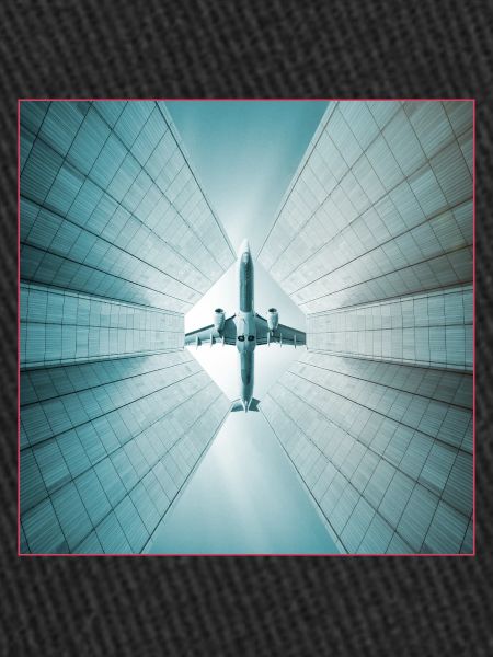 Plane over skyscrapers
