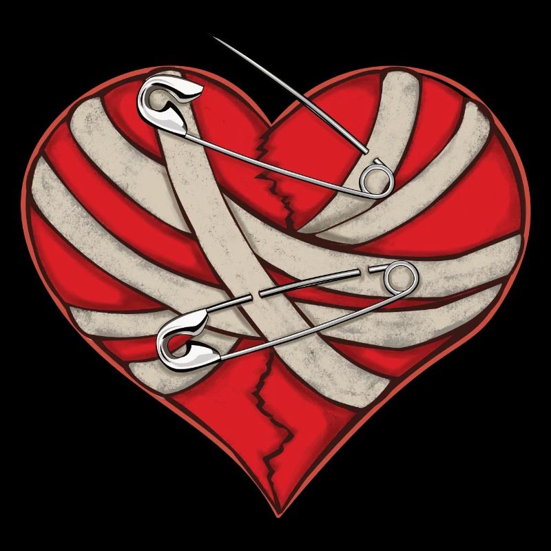 Bandage cardiaque cassé et épingles de sûreté