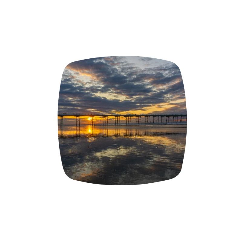 Reflets de la jetée du coucher de soleil