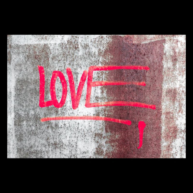 LOVE painted on rusty panel