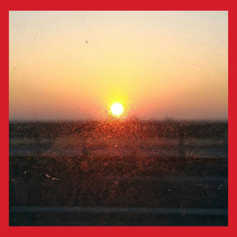 Sonnenuntergangsstrahl auf Glas