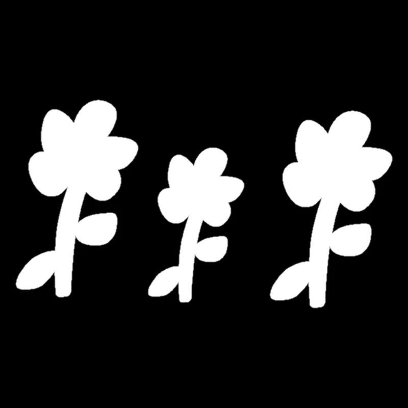 Trois fleurs en forme de plantes symbole de fleur