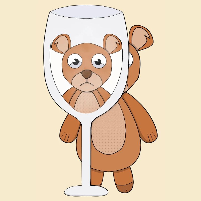 A teddy bear and empty glass