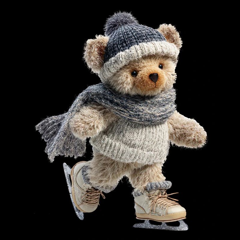 Schlittschuhteddy auf Eis mit Schal und Mütze
