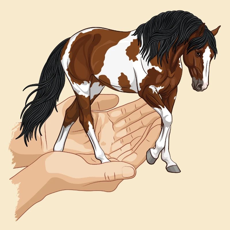 Un cheval pie qui sort de deux mains jointes