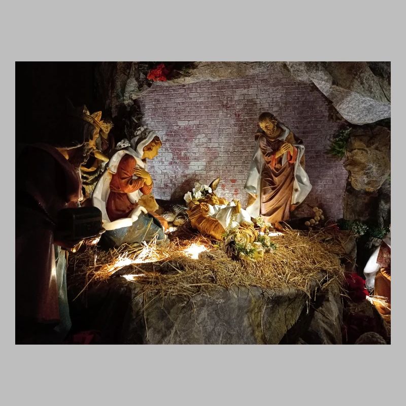 Illuminated Nativity Scene between Stones
