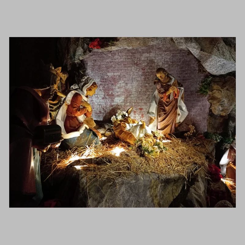 Illuminated Nativity Scene between Stones