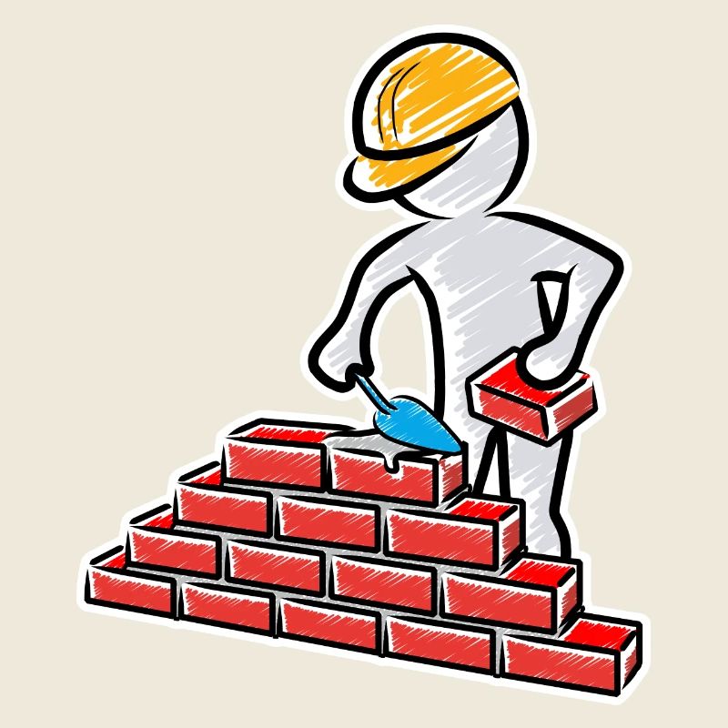 Construction worker with trowel, mortar and wall