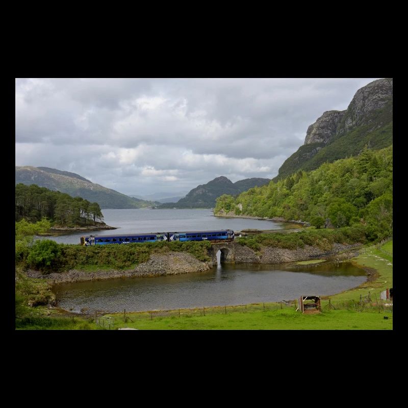 ScotRail train passing Scottish Loch