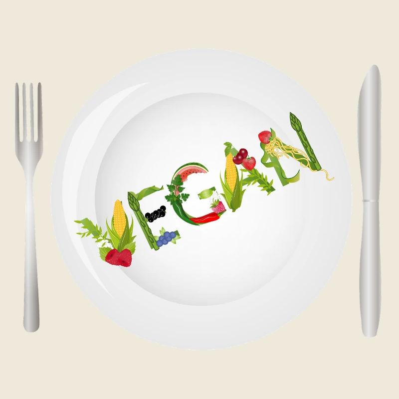 Teller mit VEGAN-Schrift aus Obst & Gemüse