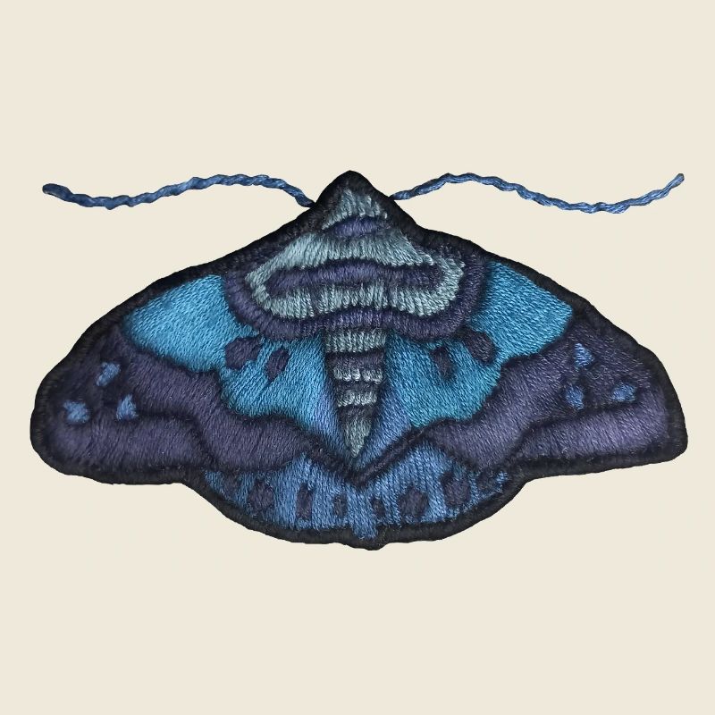 Papillon bleu – motif brodé unique