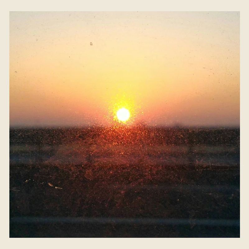Sonnenuntergangsstrahl auf Glas