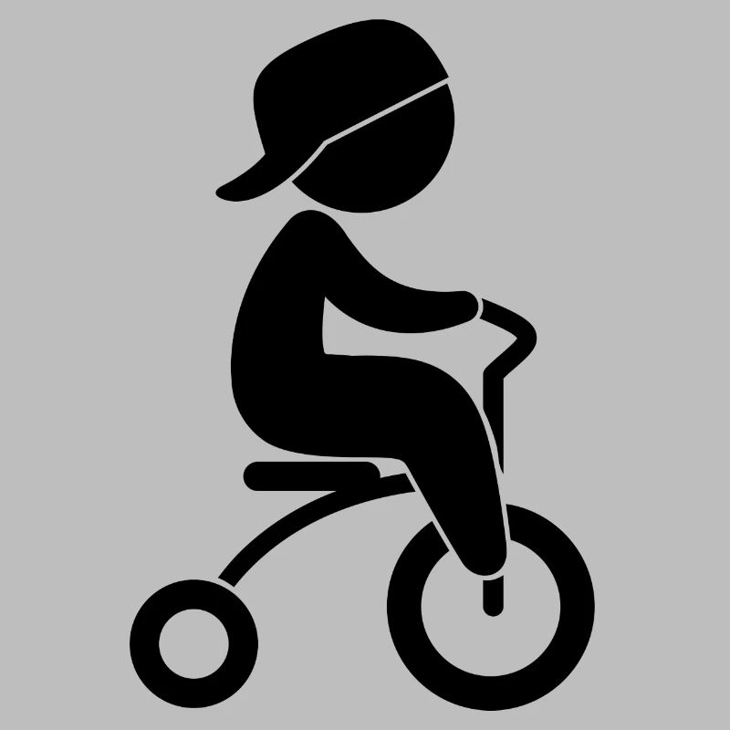 Junge, der sein Dreiräder reitet