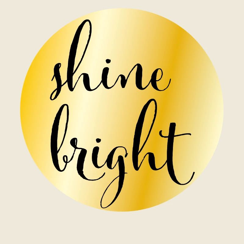 Golden circle with saying "shine bright"