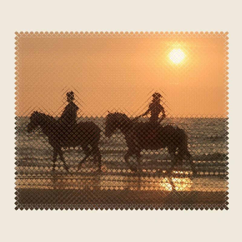 Cavalier au coucher du soleil sur la plage