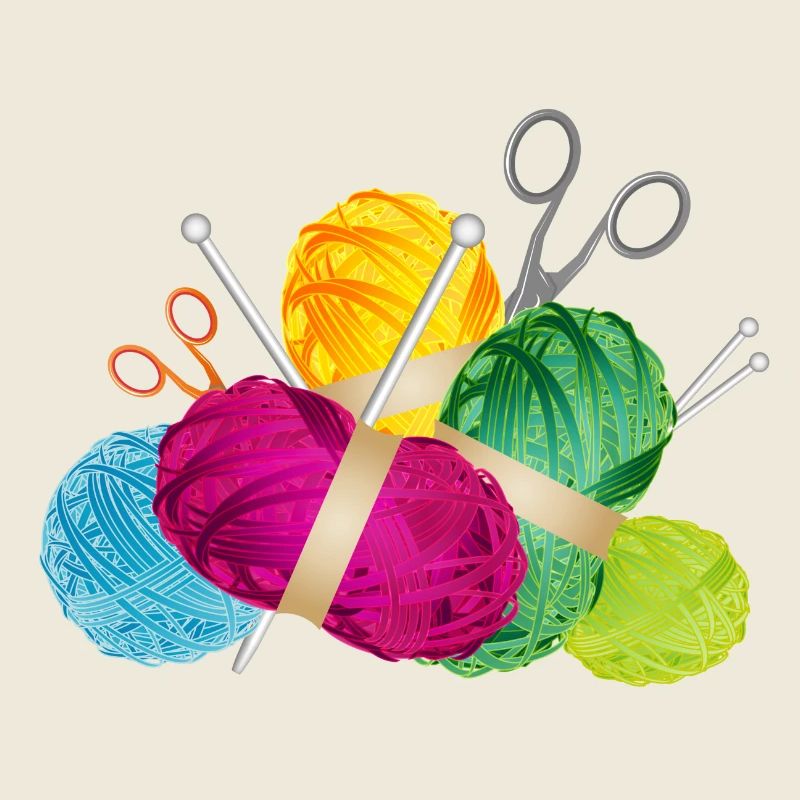 colorful balls of wool & knitting needles with scissors