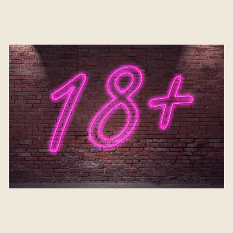 Neon age restrictions 18 + lettering on Brick Wall