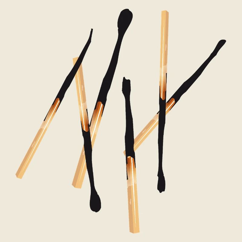 Des allumettes brûlées dans une configuration simple