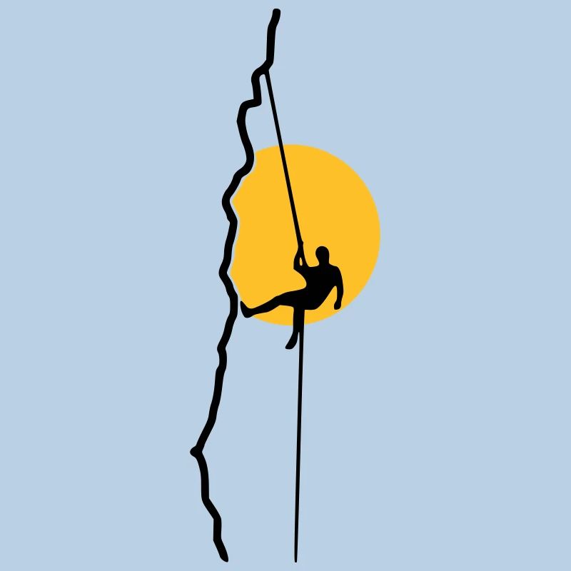 Climber rappelling in the sunset