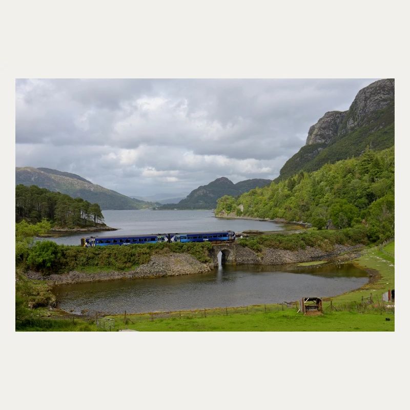 ScotRail train passing Scottish Loch