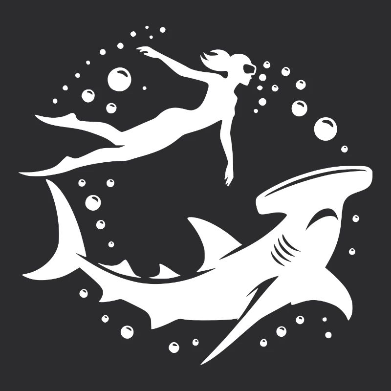 Hammerhead shark and diver floating underwater