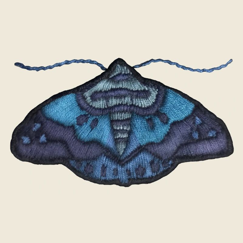 Papillon bleu – motif brodé unique