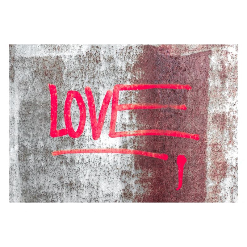 LOVE painted on rusty panel