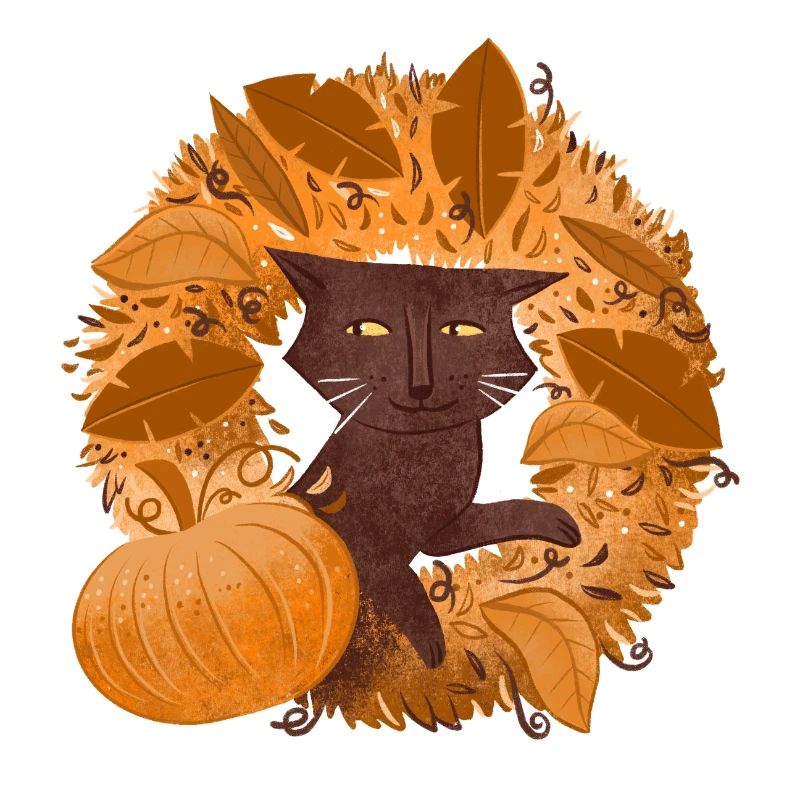 Chat brun sur une couronne de feuilles d’automne