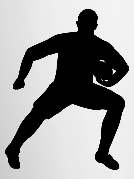 Rugby player defending ball