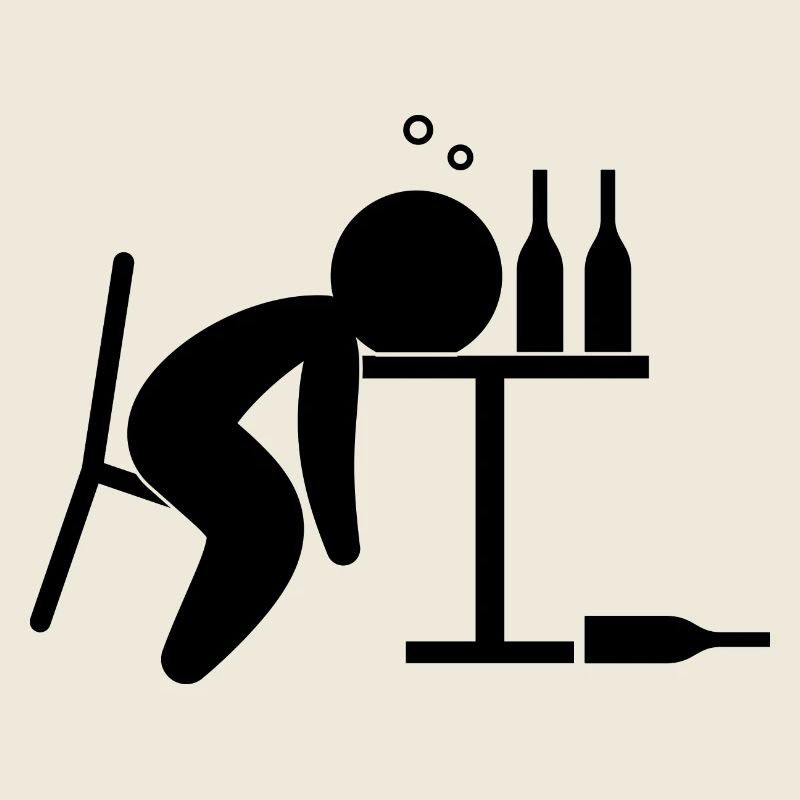 An alcoholic is drunk on the table