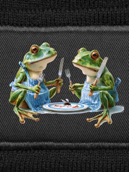 Zwei Froschköche beim Abendessen