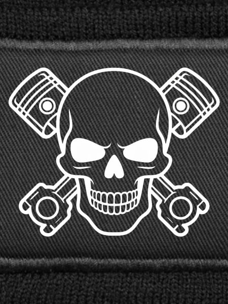 Skull with piston cross