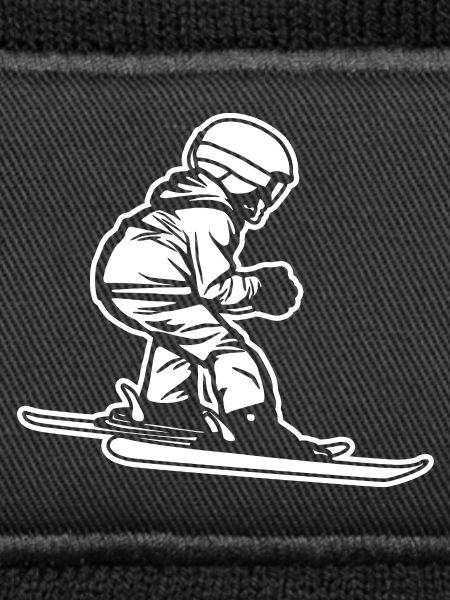 Lustiger kleiner Skifahrer
