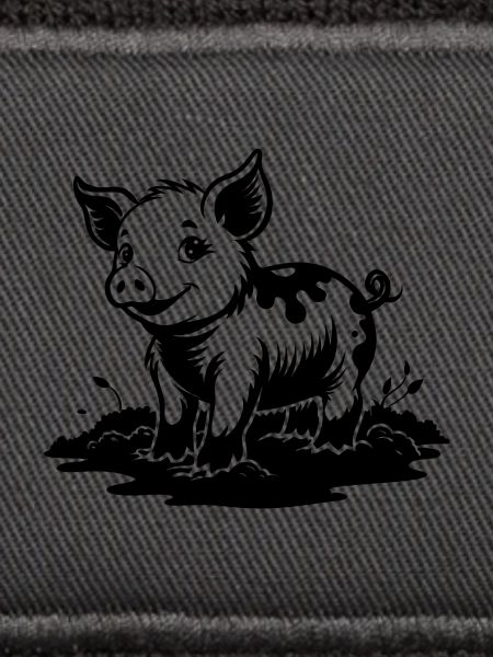 Ferkel im Schlamm