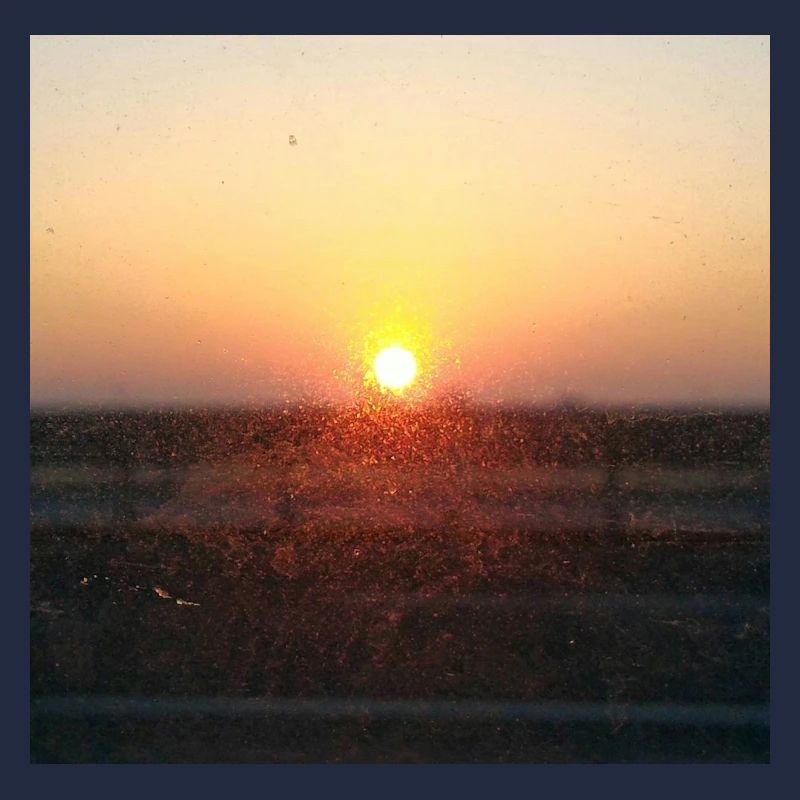 Sonnenuntergangsstrahl auf Glas