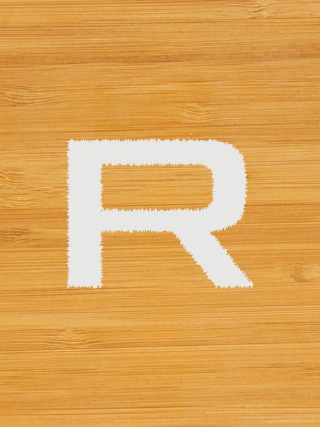 R sign with brush texture