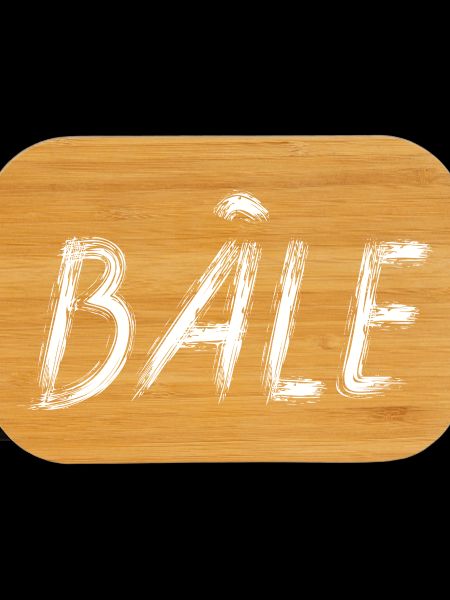 Bale in white brush lettering